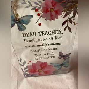 Decorative suncatcher or wall hanging for a teacher. Decorated with pink flower